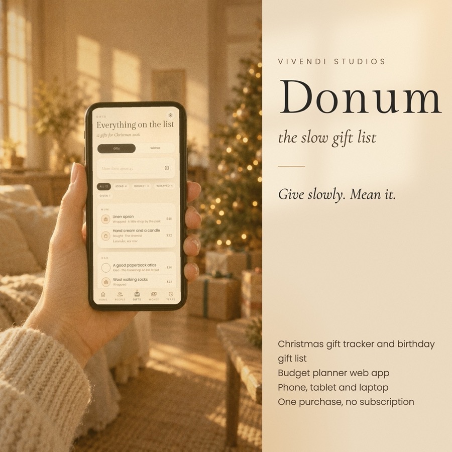 Donum on a phone beside a linen wrapped gift in golden light